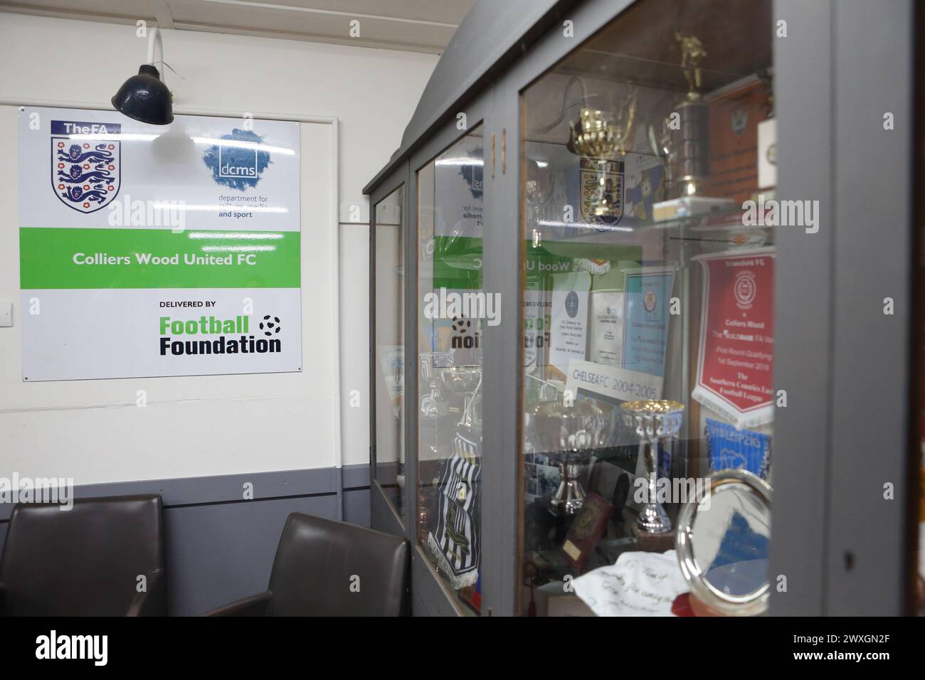 Wibbandune, Colliers Wood FC football ground, Robin Hood Way, London - Combined Counties League interior of clubhouse with trophy cabinet Stock Photo