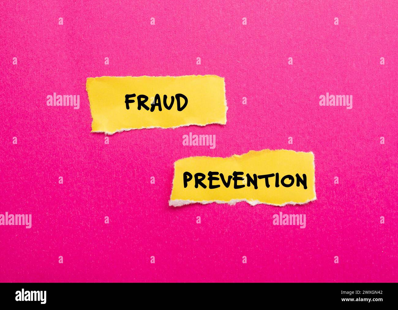 Fraud prevention words written on yellow torn paper pieces with pink background. Conceptual symbol. Copy space. Stock Photo