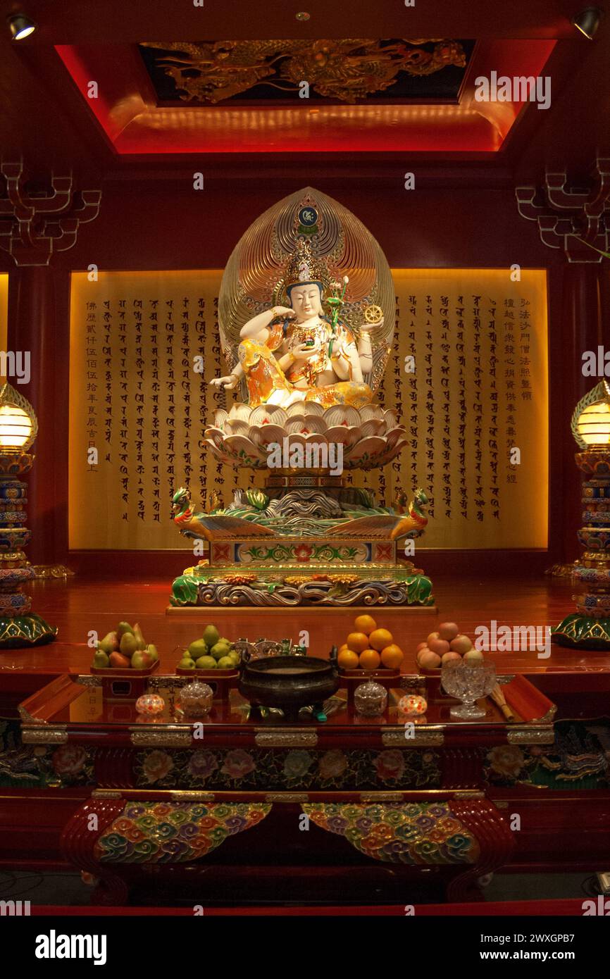 In the rear wall of the Universal Wisdom Hall (Buddha Tooth Relic Temple in Singapore), behind the Cintamanicakra Avalokitesvara Bodhisattva image are Stock Photo
