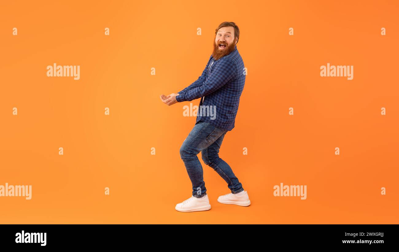 Man With Beard Holding Hands Together With Palms Up, Studio Stock Photo