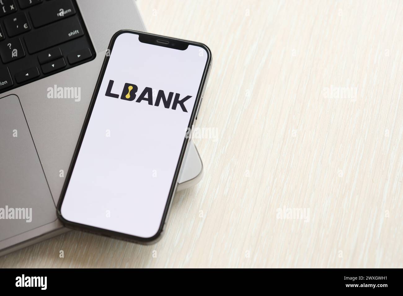 KYIV, UKRAINE - MARCH 15, 2024 Crypto com logo on iPhone display screen  with dollars and bitcoins on MacBook. Cryptocurrency exchange portal Stock  Photo - Alamy