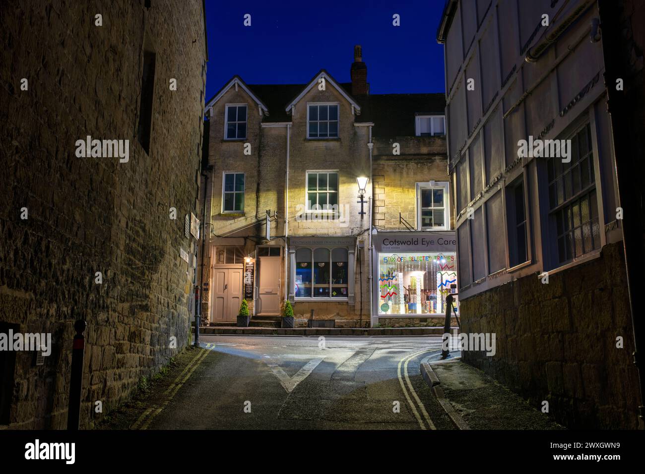 Looking up Castle street onto the high street just before dawn. Winchcombe, Cotswolds, Gloucestershire, England Stock Photo