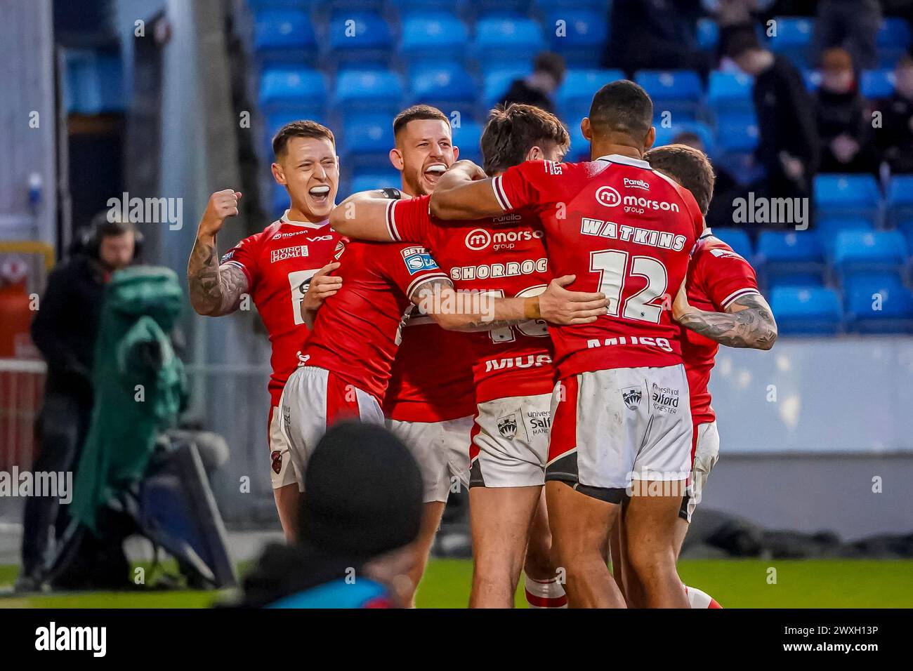 Salford, Manchester, UK. 30th March, 2024. Super League Rugby: Salford Red Devils Vs Leigh Leopards at Salford Community Stadium. Salford team all celabrating MARC SNEYD'S try. Credit James Giblin/Alamy Live News. Stock Photo