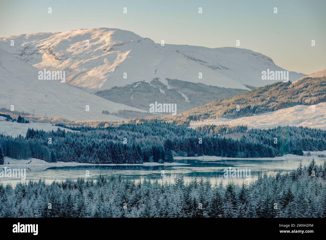 Loch Tulla and snow-capped mountains in the Scottish Highlands Stock Photo