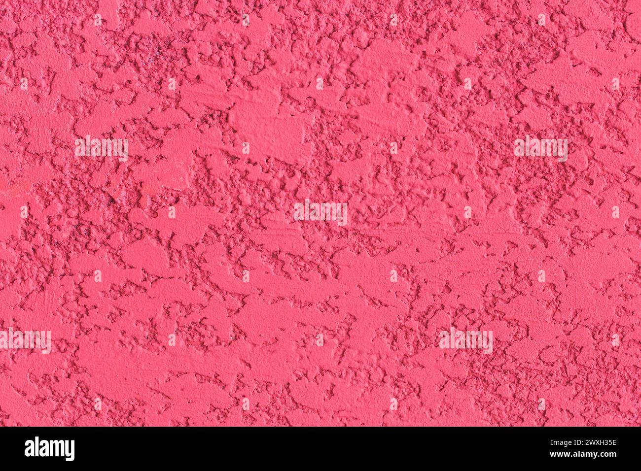 Pink paint texture plaster wall rough stucco background solid abstract pattern structure. Stock Photo
