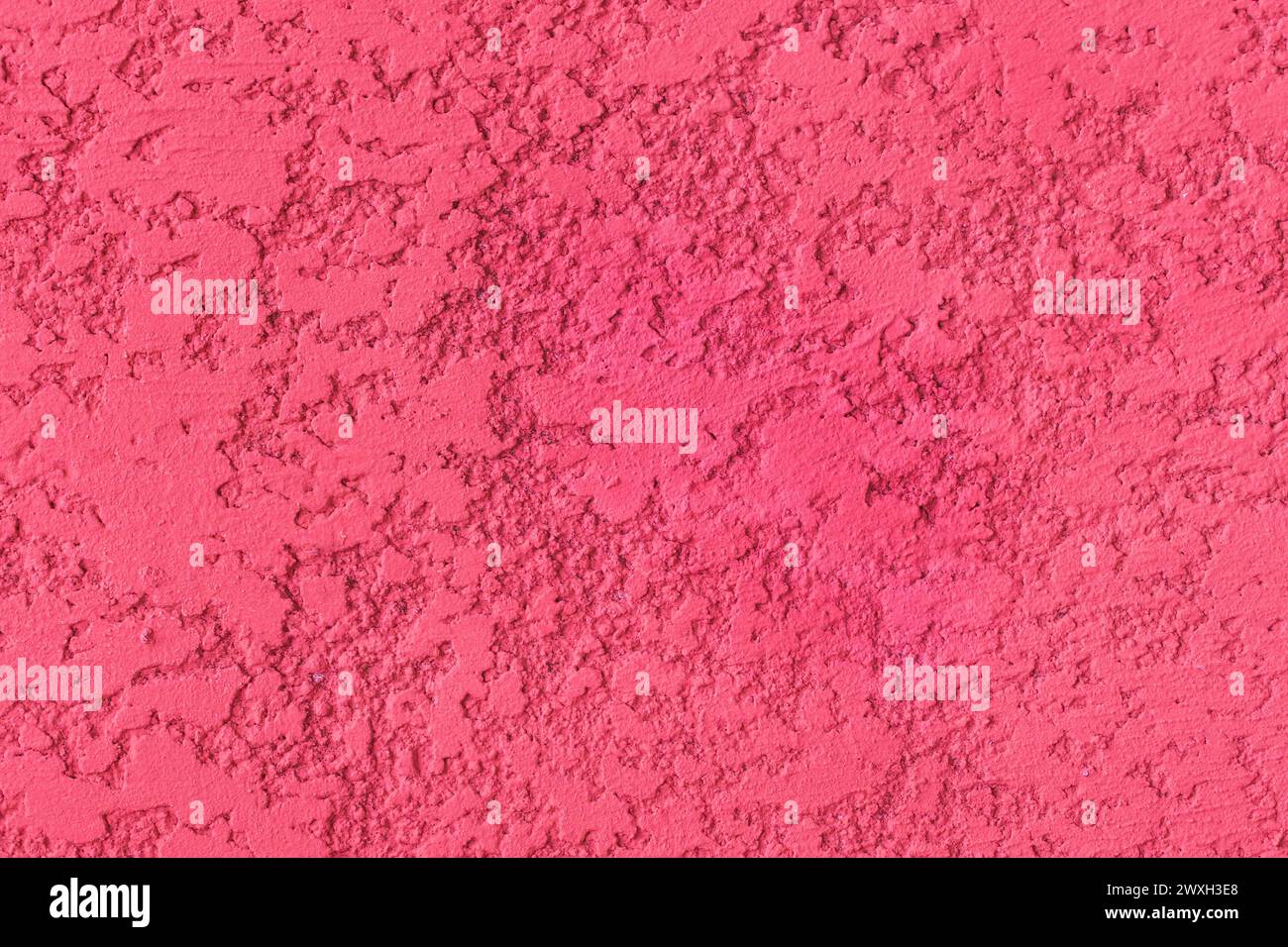 Pink paint rough plaster wall surface solid abstract stucco pattern background texture cement. Stock Photo