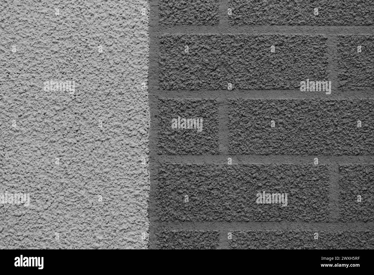 Grey rough dark wall brick abstract pattern two colors plaster texture