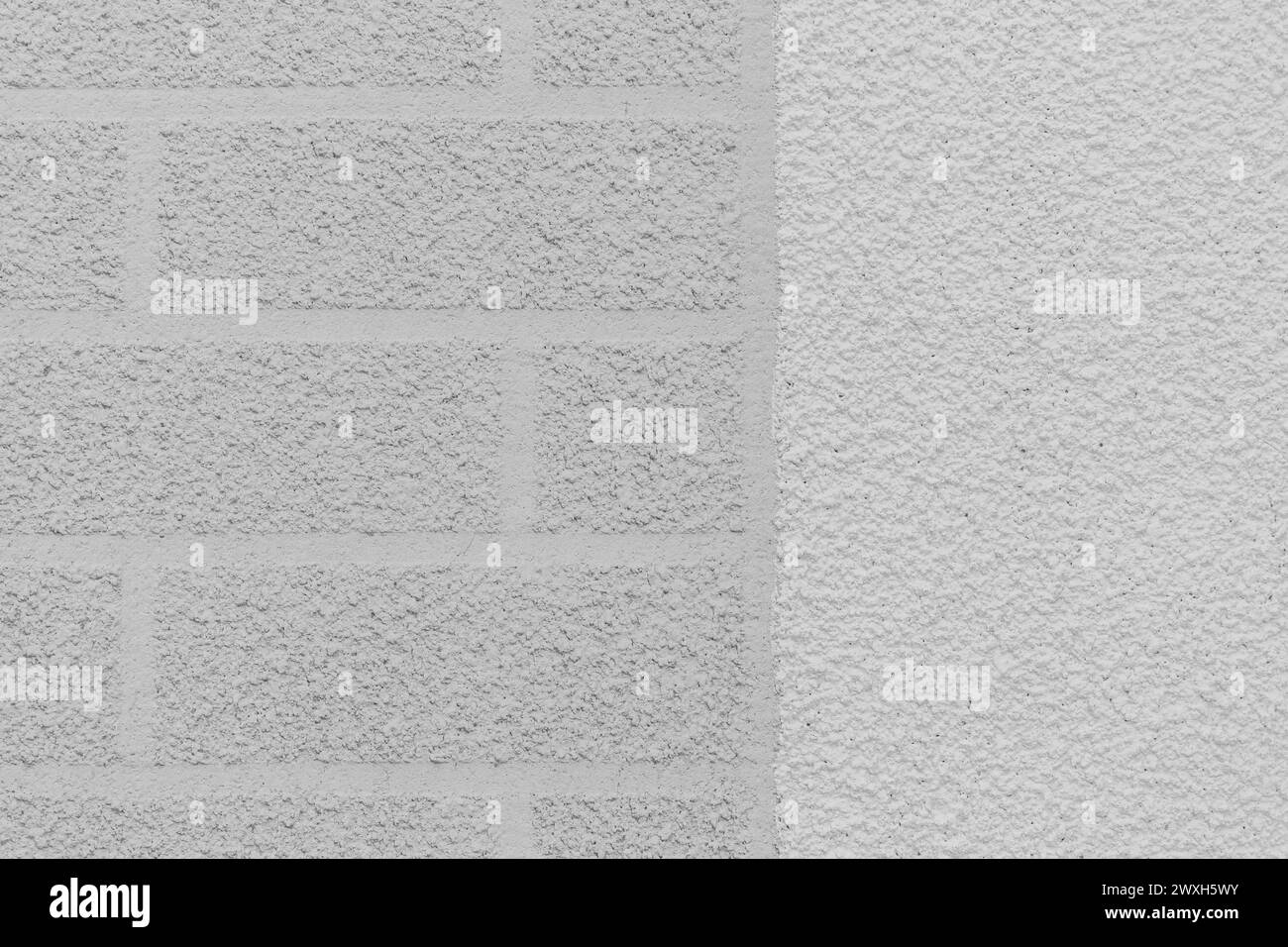 Grey rough wall brick abstract pattern two colors white plaster texture