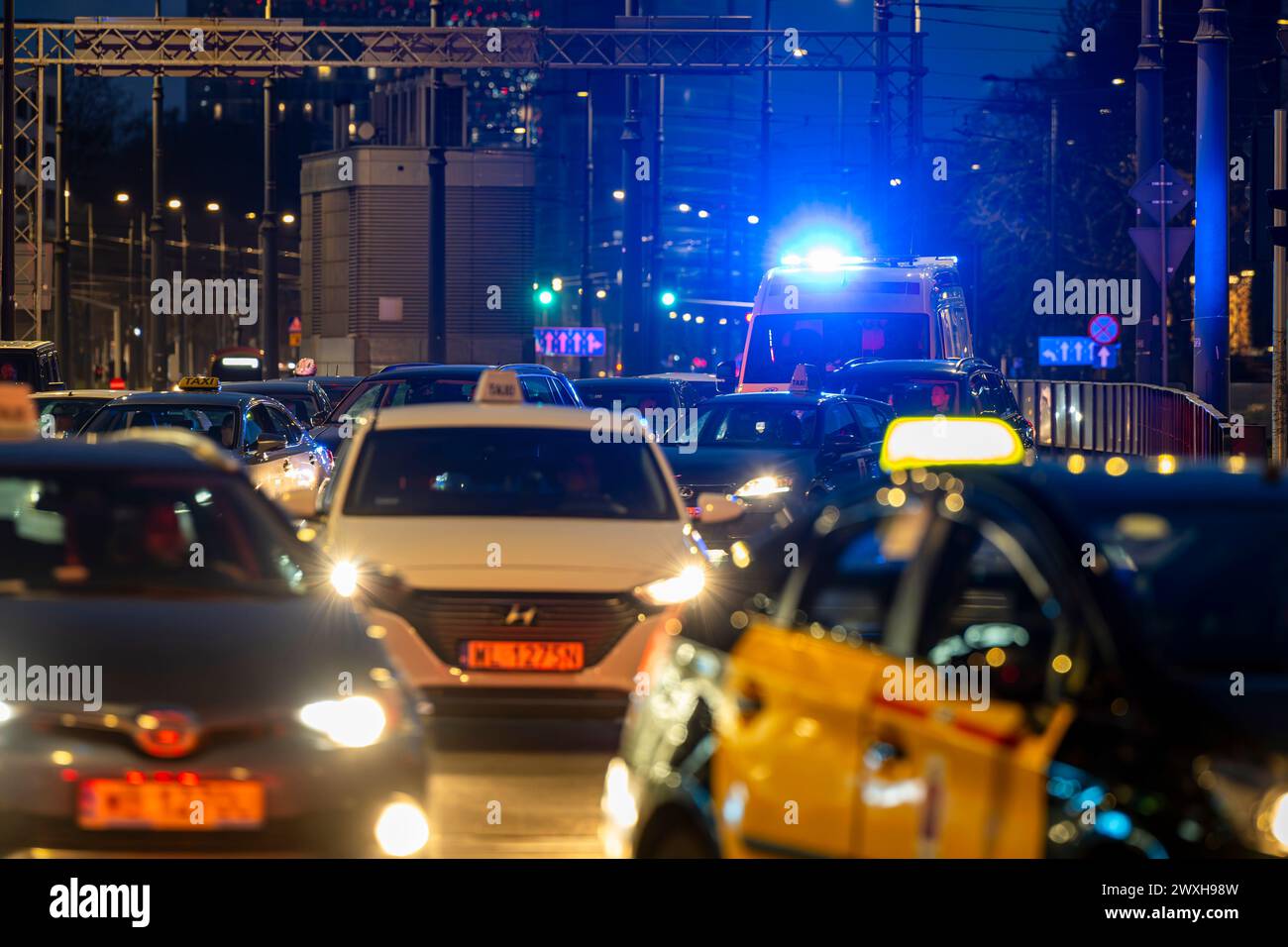 Warsaw, Poland - March 30, 2024: An ambulance trying to get through a traffic jam in the city center. Stock Photo