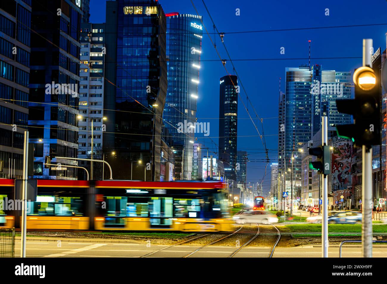 Warsaw, Poland - March 30, 2024: Night traffic in the city center. Stock Photo