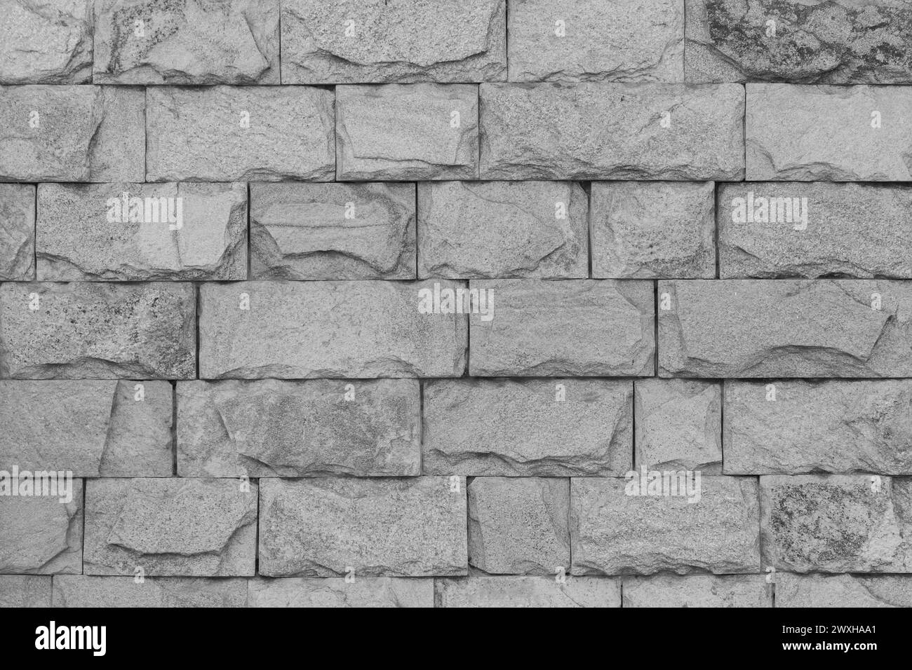 Grey stone wall brickwork brick wall masonry texture background pattern abstract old. Stock Photo