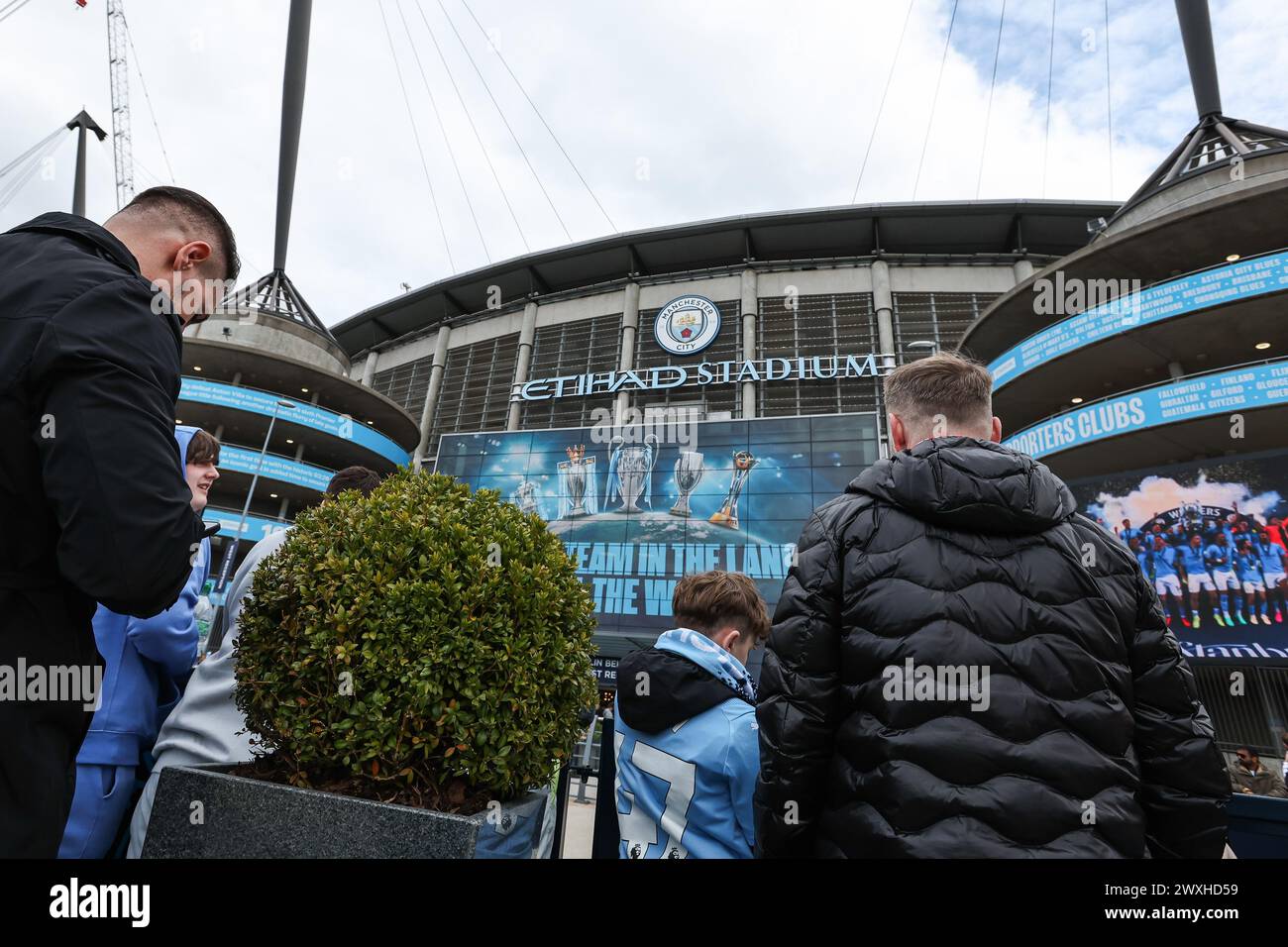 Fans arrive ahead of the the Premier League match Manchester City vs Arsenal at Etihad Stadium, Manchester, United Kingdom, 31st March 2024  (Photo by Mark Cosgrove/News Images) Stock Photo