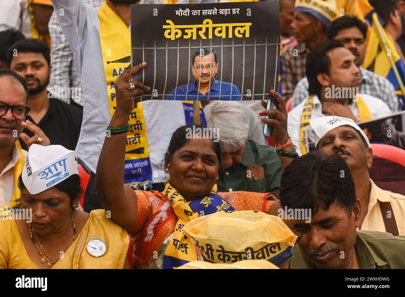 New Delhi, Delhi, India. 31st Mar, 2024. A supporter of the Aam Aadmi Party holds a placard during a mega rally organised by various opposition parties of India, in New Delhi, India on March 31, 2024. (Credit Image: © Kabir Jhangiani/ZUMA Press Wire) EDITORIAL USAGE ONLY! Not for Commercial USAGE! Credit: ZUMA Press, Inc./Alamy Live News Stock Photo