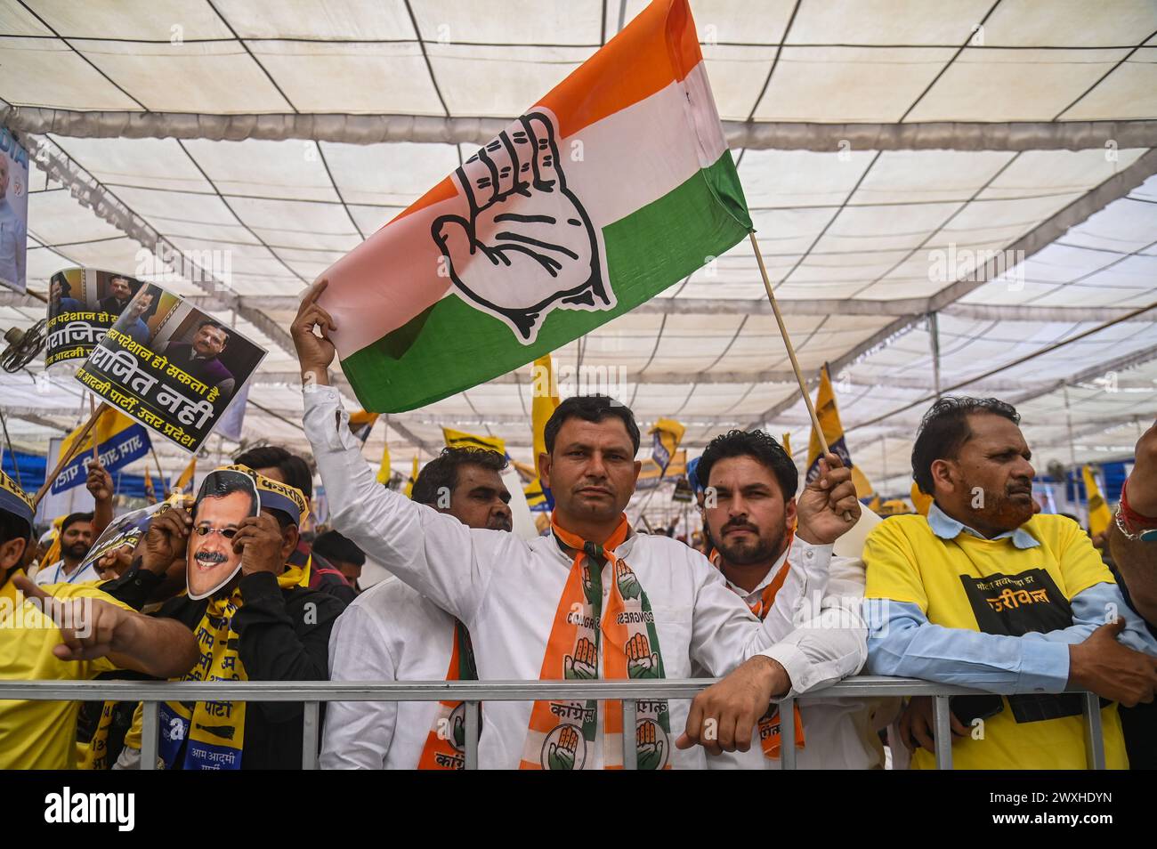 New Delhi, Delhi, India. 31st Mar, 2024. A supporter of the Indian National Congress holds a flag during a mega rally organised by various opposition parties of India, in New Delhi, India on March 31, 2024. (Credit Image: © Kabir Jhangiani/ZUMA Press Wire) EDITORIAL USAGE ONLY! Not for Commercial USAGE! Credit: ZUMA Press, Inc./Alamy Live News Stock Photo