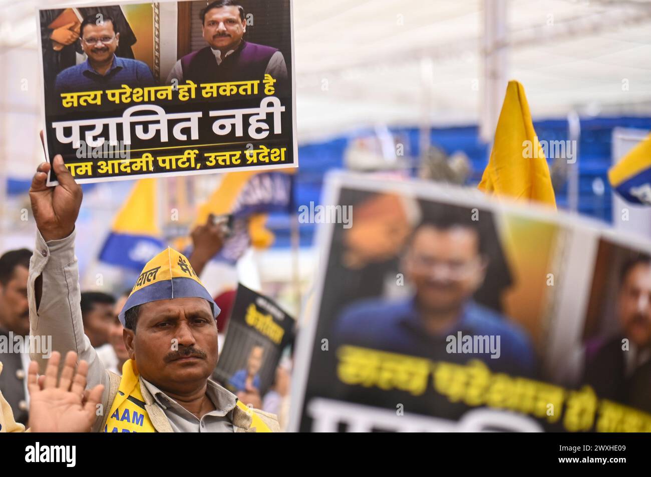 New Delhi, Delhi, India. 31st Mar, 2024. A supporter of the Aam Aadmi Party holds a placard during a mega rally organised by various opposition parties of India, in New Delhi, India on March 31, 2024. (Credit Image: © Kabir Jhangiani/ZUMA Press Wire) EDITORIAL USAGE ONLY! Not for Commercial USAGE! Credit: ZUMA Press, Inc./Alamy Live News Stock Photo
