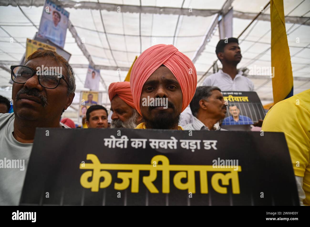 New Delhi, Delhi, India. 31st Mar, 2024. A supporter of the Aam Aadmi Party holds a placard during a mega rally organised by various opposition parties of India, in New Delhi, India on March 31, 2024. (Credit Image: © Kabir Jhangiani/ZUMA Press Wire) EDITORIAL USAGE ONLY! Not for Commercial USAGE! Credit: ZUMA Press, Inc./Alamy Live News Stock Photo