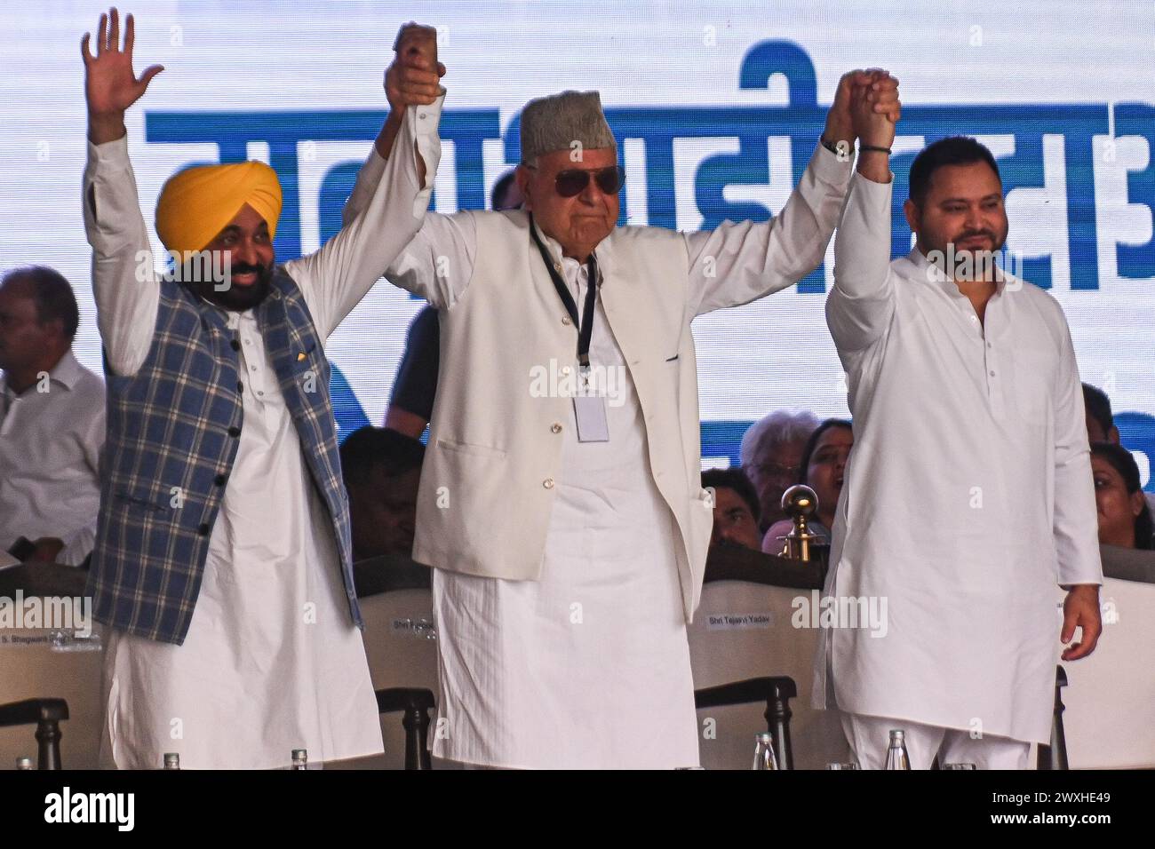 New Delhi, Delhi, India. 31st Mar, 2024. Bhagwant Mann (L), Chief Minister of Punjab, Farooq Abdullah (C), President of Jammu and Kashmir National Conference, and Tejashwi Yadav (R), former deputy Chief Minister of Bihar, hold hands during a mega rally organised by various opposition parties of India, in New Delhi, India on March 31, 2024. (Credit Image: © Kabir Jhangiani/ZUMA Press Wire) EDITORIAL USAGE ONLY! Not for Commercial USAGE! Credit: ZUMA Press, Inc./Alamy Live News Stock Photo