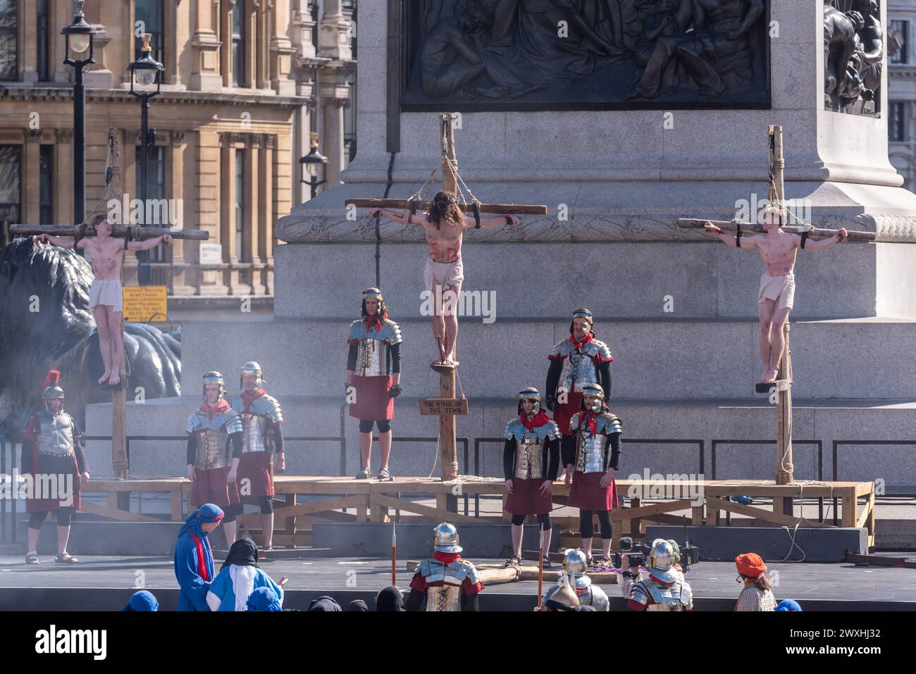The Passion of Christ open air play by Wintershall in Trafalgar Square, London, on Easter Good Friday. Jesus and thieves on crosses, crucifixion Stock Photo