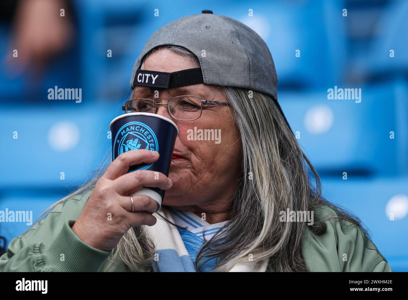 Fans arrive ahead of the Premier League match Manchester City vs Arsenal at Etihad Stadium, Manchester, United Kingdom, 31st March 2024  (Photo by Mark Cosgrove/News Images) Stock Photo