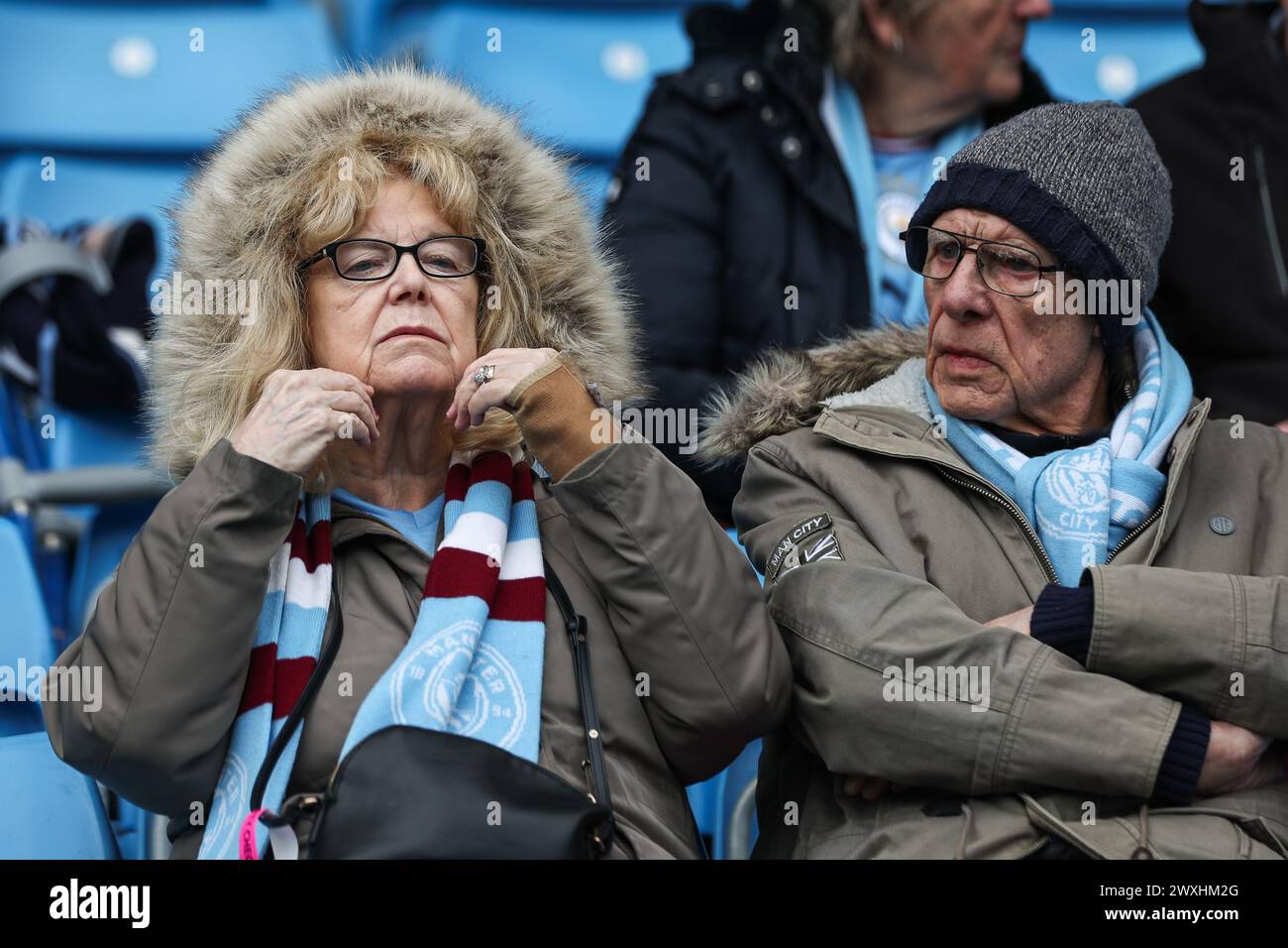 Fans arrive ahead of the Premier League match Manchester City vs Arsenal at Etihad Stadium, Manchester, United Kingdom, 31st March 2024  (Photo by Mark Cosgrove/News Images) Stock Photo