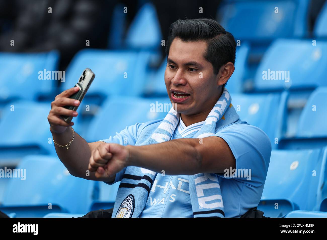 Fans arrive ahead of the Premier League match Manchester City vs Arsenal at Etihad Stadium, Manchester, United Kingdom. 31st Mar, 2024. (Photo by Mark Cosgrove/News Images) in, on 3/31/2024. (Photo by Mark Cosgrove/News Images/Sipa USA) Credit: Sipa USA/Alamy Live News Stock Photo