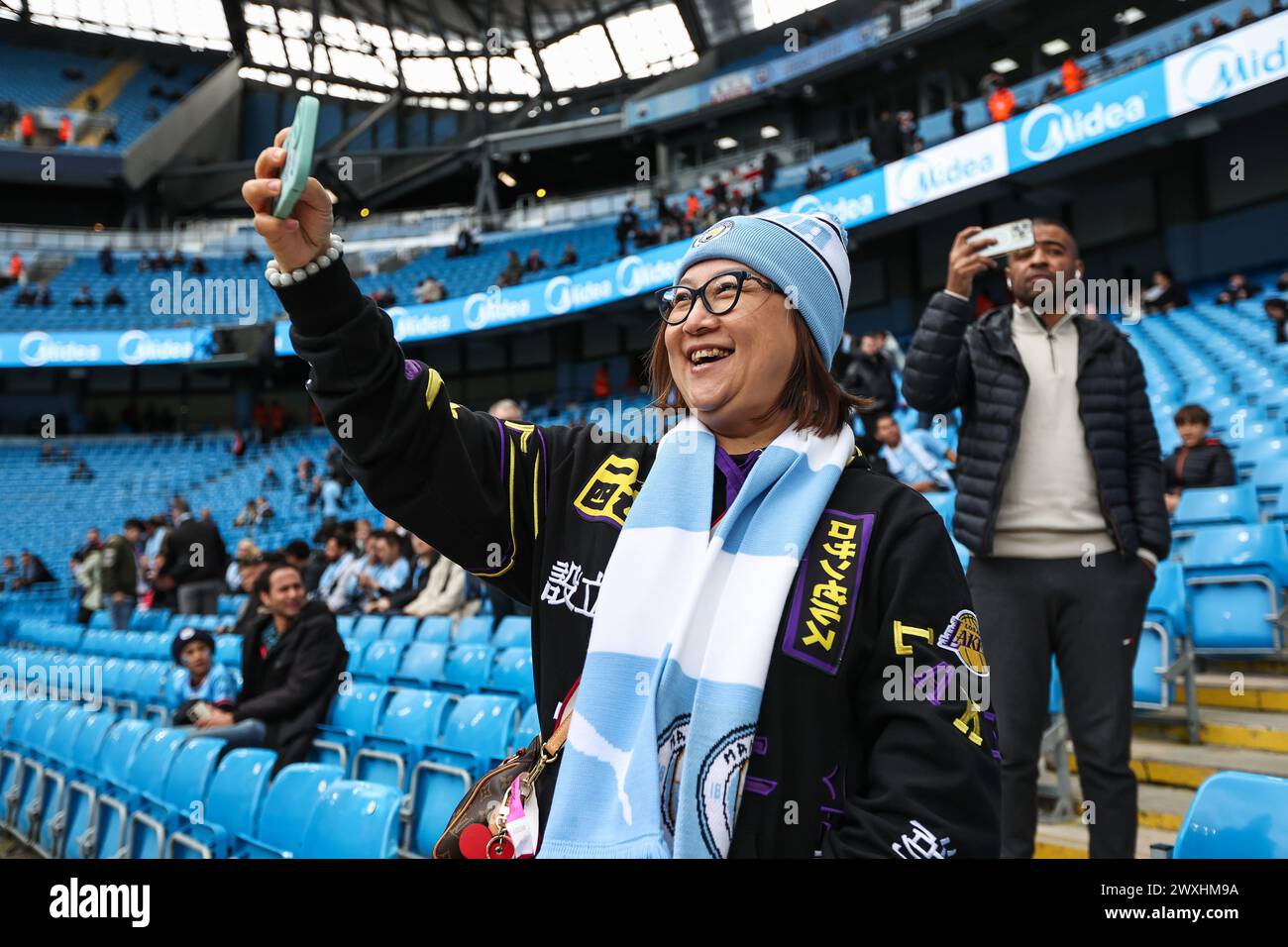 Fans arrive ahead of the Premier League match Manchester City vs Arsenal at Etihad Stadium, Manchester, United Kingdom. 31st Mar, 2024. (Photo by Mark Cosgrove/News Images) in, on 3/31/2024. (Photo by Mark Cosgrove/News Images/Sipa USA) Credit: Sipa USA/Alamy Live News Stock Photo