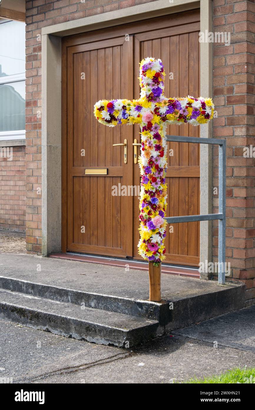 Easter celebrations with a cross made of flowers. Potters Wood Methodist Church Stock Photo