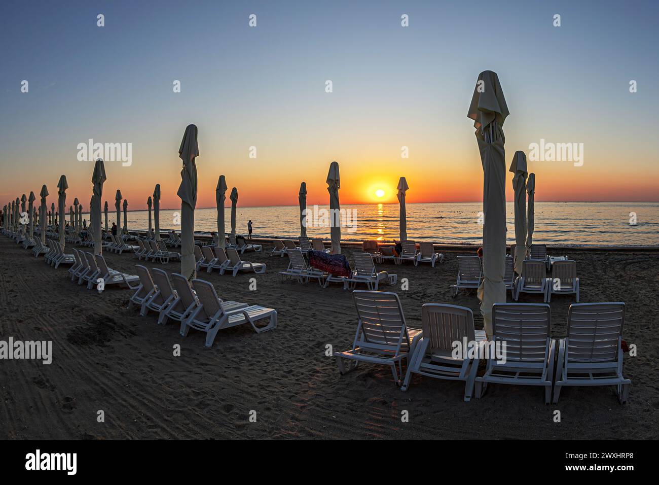 Black Sea beach in Mamaia, Romania. Sunset in July and view in fish eye lens. Stock Photo