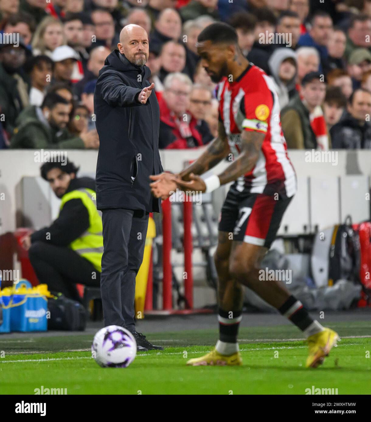 London, UK. 30th Mar, 2024 - Brentford v Manchester United - Premier League - GTech Community Stadium.                                        Manchester United Manager Erik ten Hag on the touchline. Ivan Toney is in the foreground.                                                                       Picture Credit: Mark Pain / Alamy Live News Stock Photo