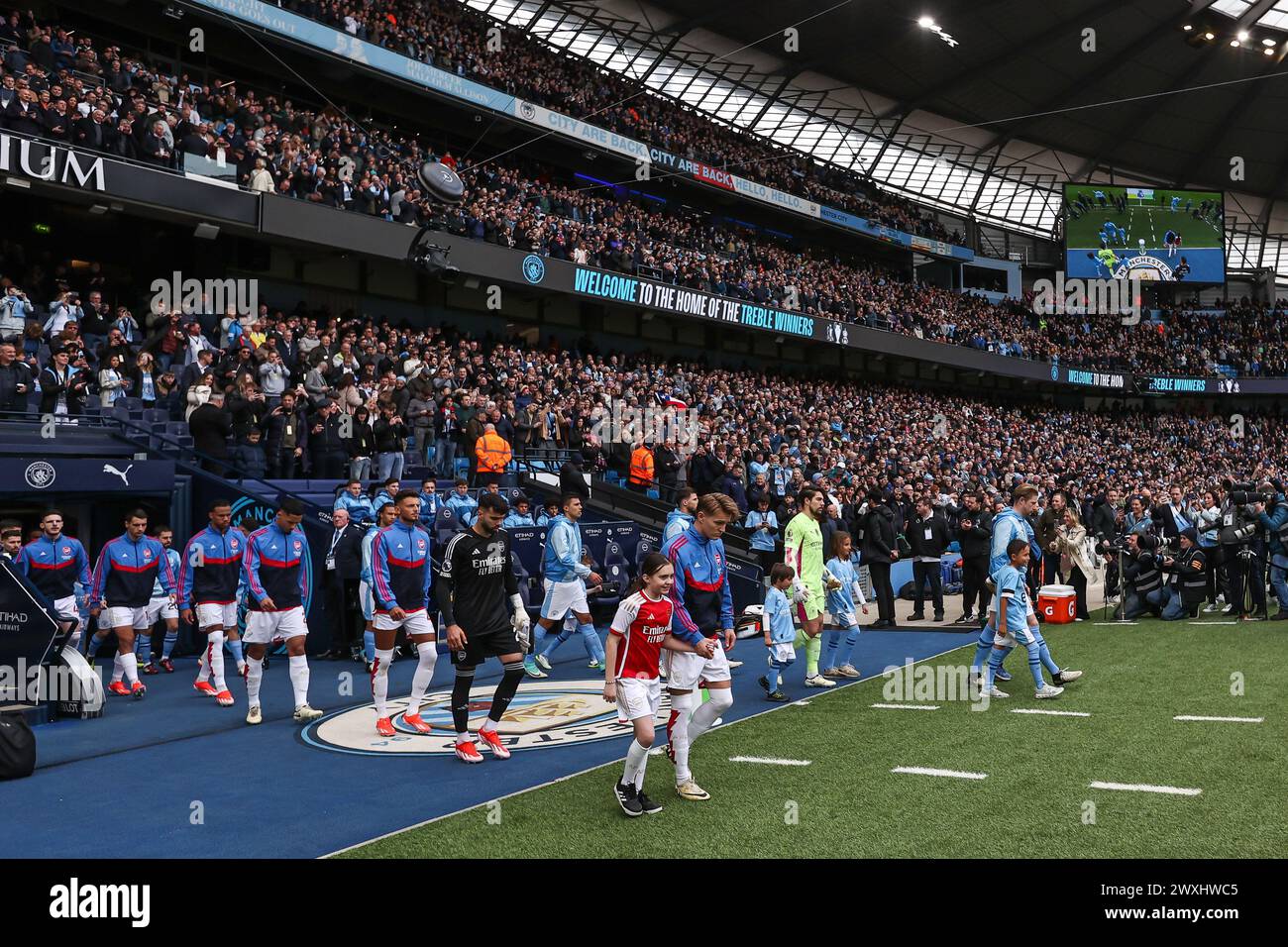 Teams come out ahead of the Premier League match Manchester City vs Arsenal at Etihad Stadium, Manchester, United Kingdom. 31st Mar, 2024. (Photo by Mark Cosgrove/News Images) in, on 3/31/2024. (Photo by Mark Cosgrove/News Images/Sipa USA) Credit: Sipa USA/Alamy Live News Stock Photo