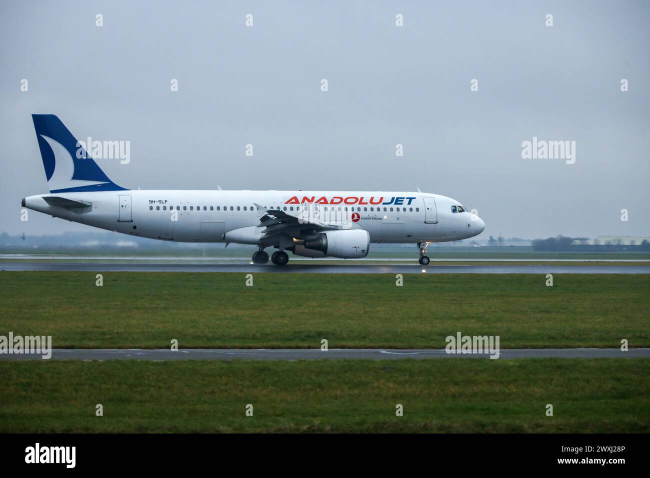 9H-SLF AnadoluJet Airbus A320-214 aircraft makes a landing on Polderbaan upon arrival at Amsterdam Schiphol airport Netherlands Stock Photo