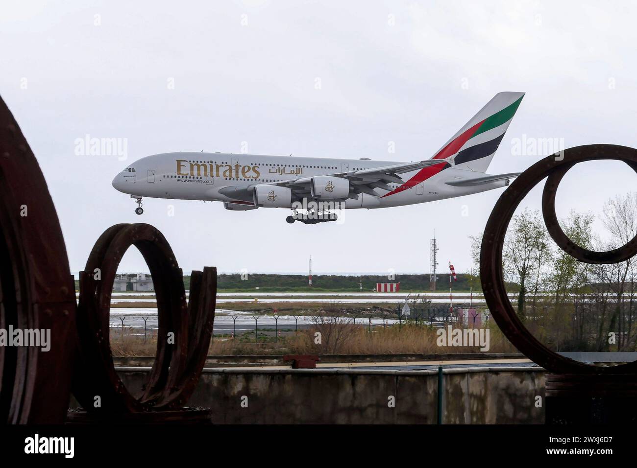 © Francois Glories/MAXPPP - 31/03/2024 The world's largest long-haul aircraft, the Airbus A380, is returning to Nice airport today for the route between Nice and Dubai, operated by Emirates. Behind the buildings of Marina Baie des Anges. Credit: MAXPPP/Alamy Live News Stock Photo