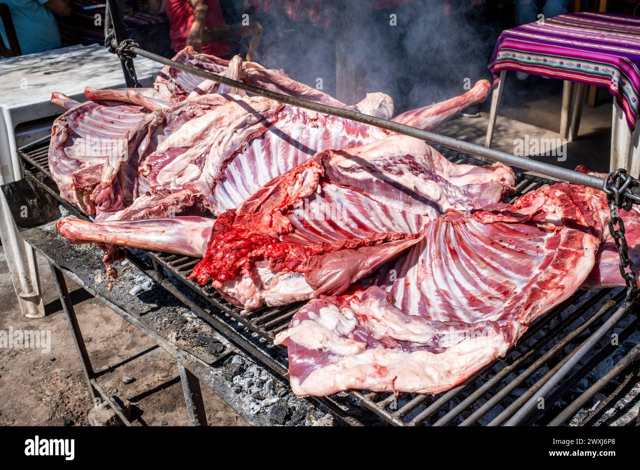 Meat Cooking On A Barbecue Outside A Restaurant In Tilcara, Jujuy Province, Argentina. Stock Photo