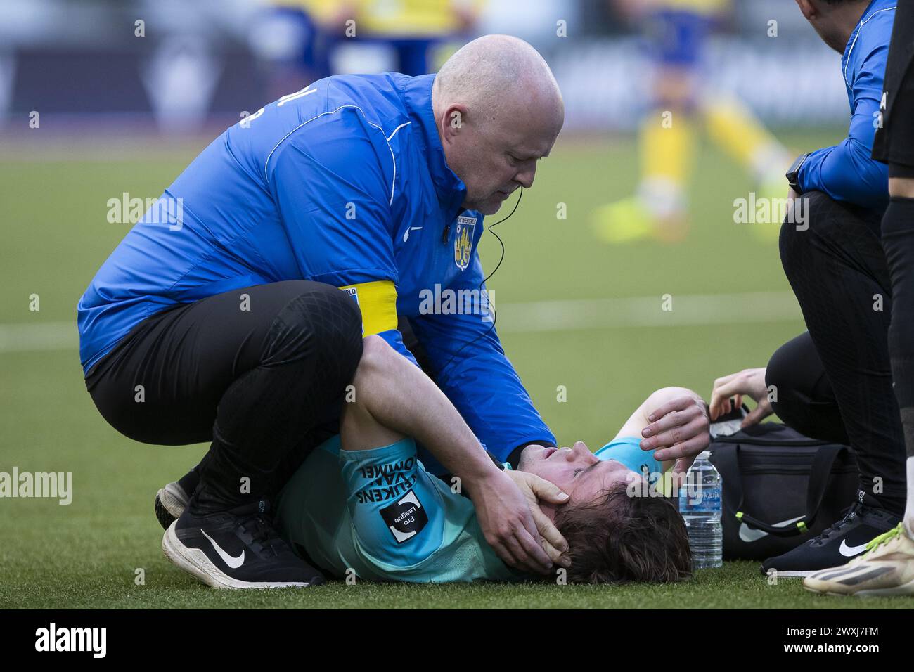 Sint Truiden, Belgium. 31st Mar, 2024. Westerlo's Tuur Rommens receives medical treatment during