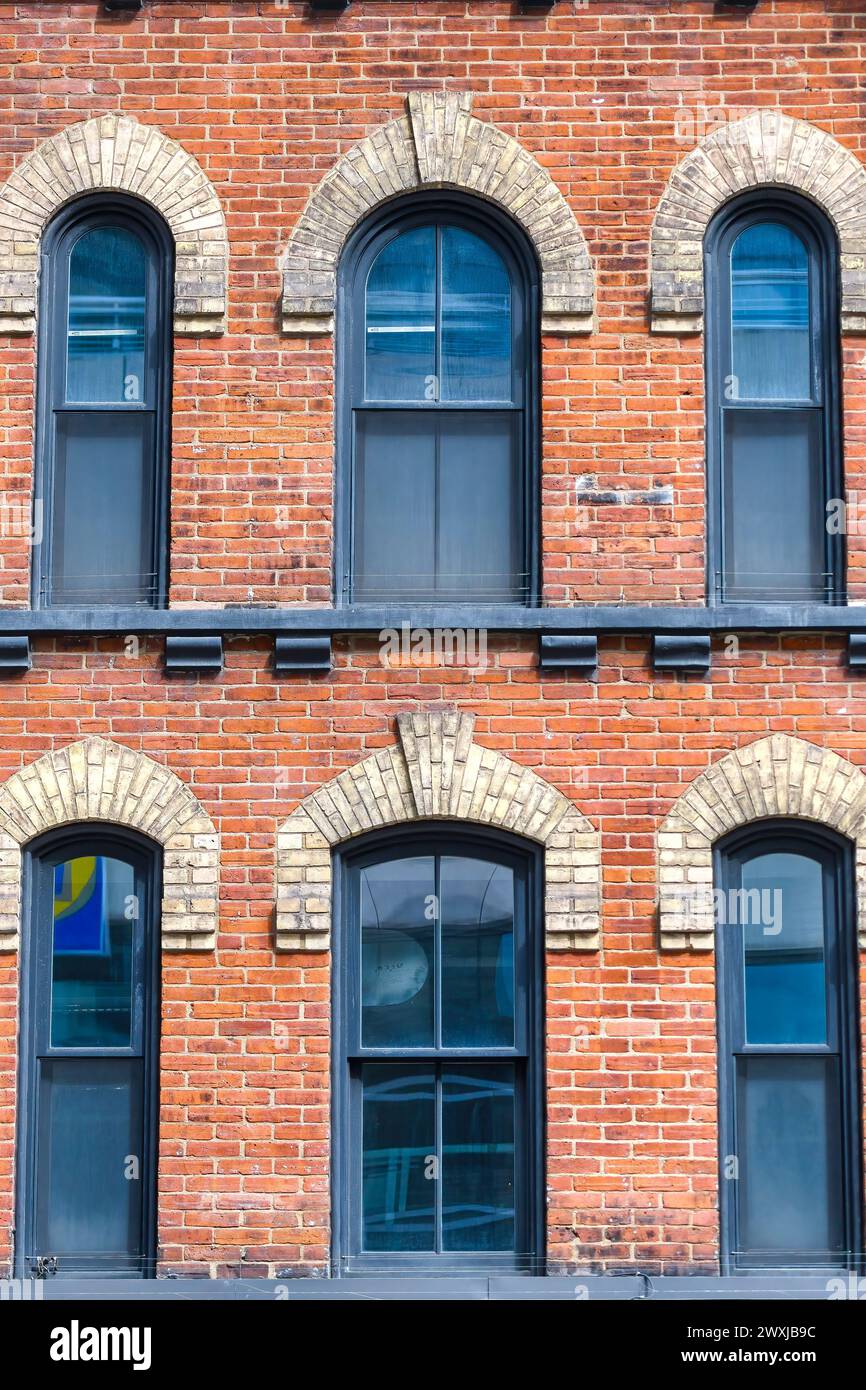 Windows and brick architecture building in Yonge Street, Toronto, Canada Stock Photo