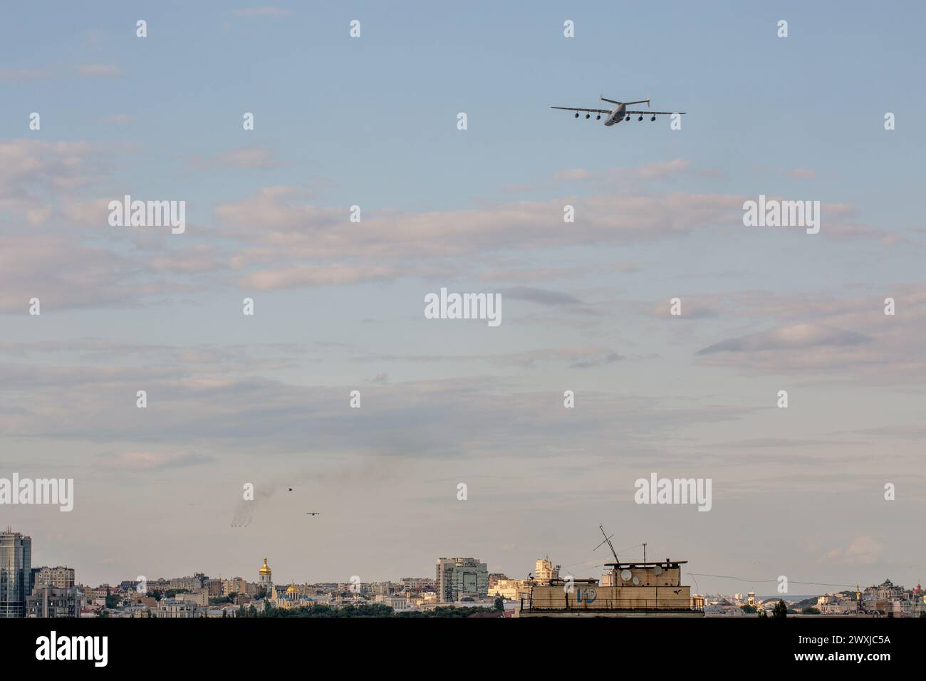 Kyiv, Ukraine - August 22., 2021: Aerial summer cityscape with flying airplane Antonov AN-225 Mriya during parade dedicated to Independence Day of Ukr Stock Photo