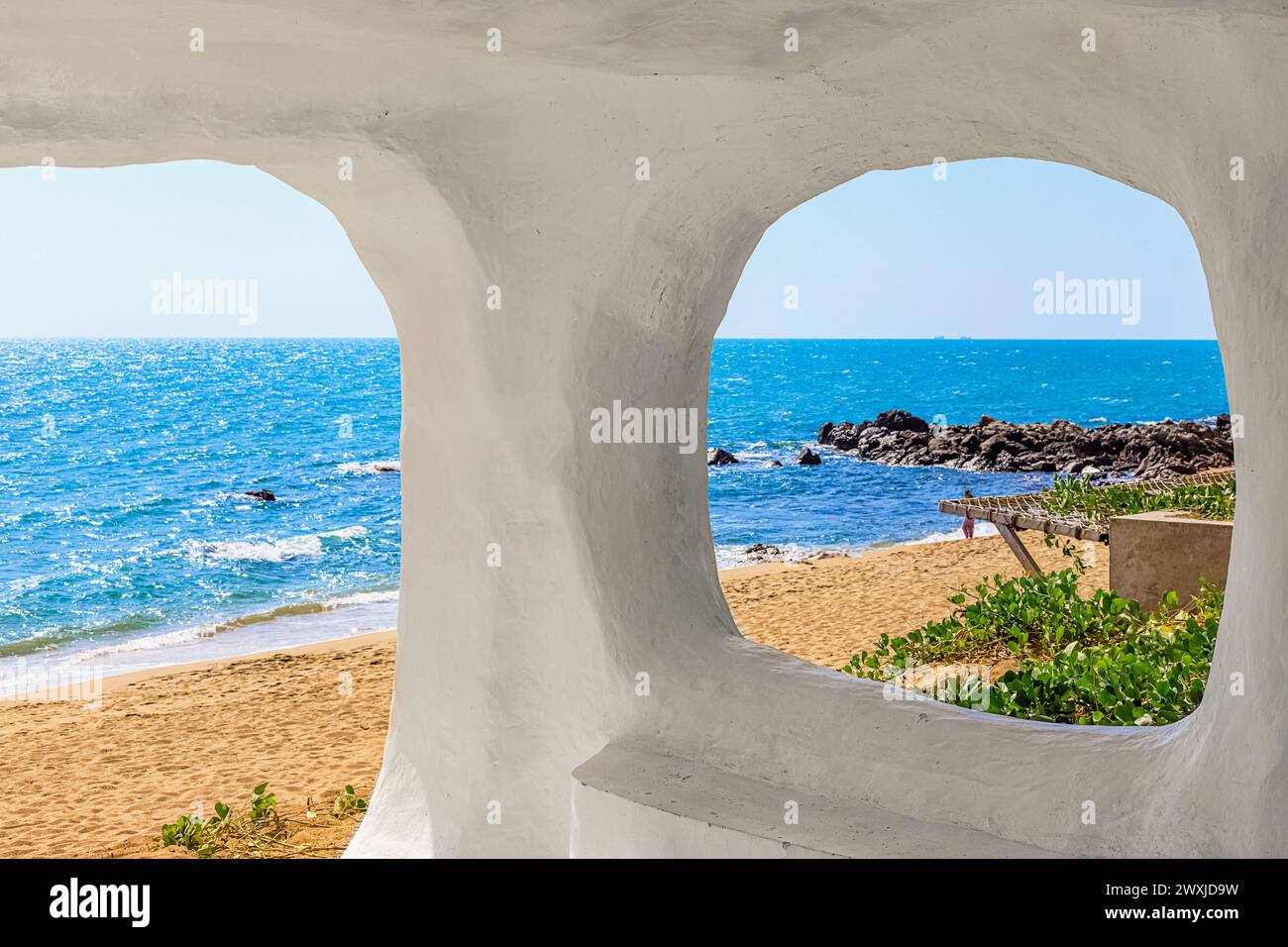 Beach at World's End Park, Sanya, China. View of the beautiful beach and sea from the white bungalow. Rest and relaxation concept Stock Photo