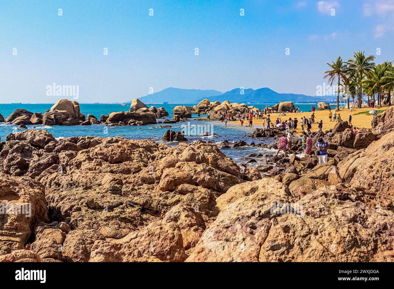 View of the rocky shore of the South China Sea in the World's End Park. Sanya, China. Stock Photo