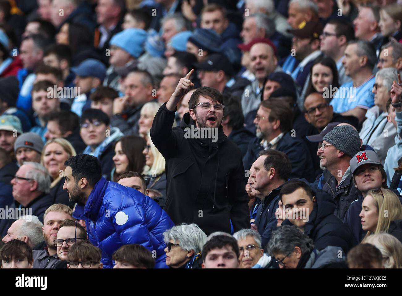 A fans chants during the Premier League match Manchester City vs Arsenal at Etihad Stadium, Manchester, United Kingdom, 31st March 2024  (Photo by Mark Cosgrove/News Images) Stock Photo