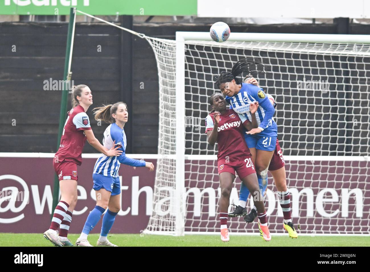 Dagenham, Kent, UK. Sunday 31st March 2024.Madison Haley (21 Brighton) challenges Viviane Assey (20 West Ham) for the ball during the Barclays FA Women's Super League match between West Ham United and Brighton and Hove Albion at the Chigwell Construction Stadium, Dagenham on Sunday 31st March 2024. (Photo: Kevin Hodgson | MI News) Credit: MI News & Sport /Alamy Live News Stock Photo