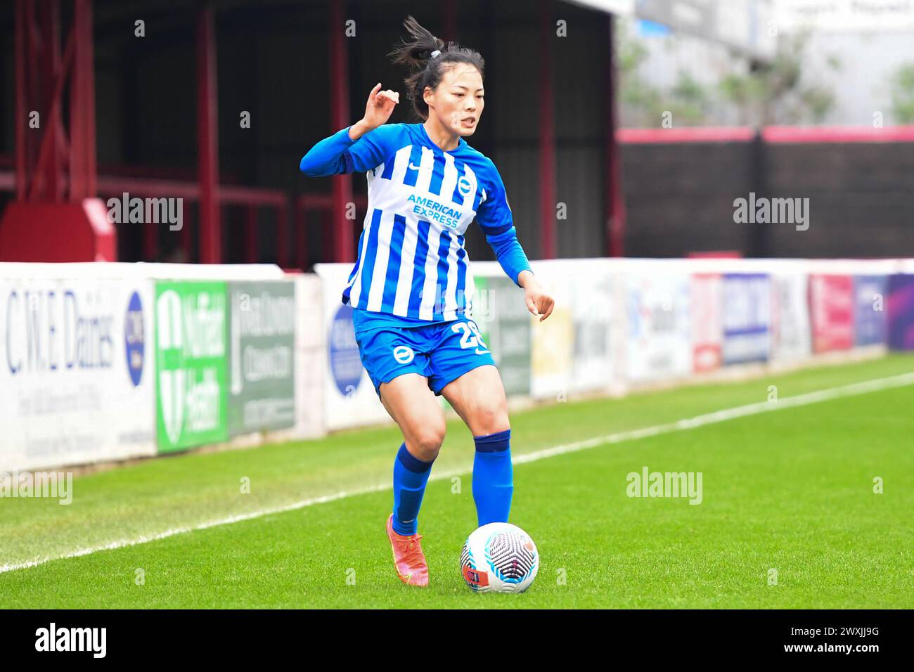 Dagenham, Kent, UK. Sunday 31st March 2024.Mengwen Li (26 Brighton) controls the ball during the Barclays FA Women's Super League match between West Ham United and Brighton and Hove Albion at the Chigwell Construction Stadium, Dagenham on Sunday 31st March 2024. (Photo: Kevin Hodgson | MI News) Credit: MI News & Sport /Alamy Live News Stock Photo