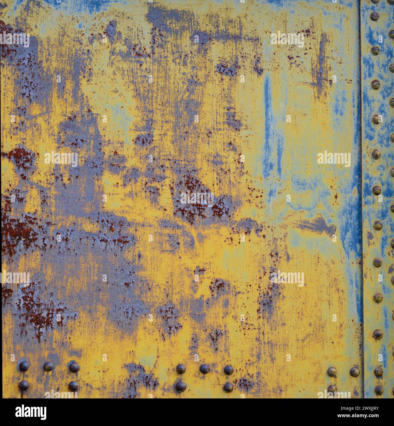Metal texture with rivets as steam punk. Worn steel texture or metal. Dark worn rusty metal texture background. Scratched and spotted rusty metal Stock Photo