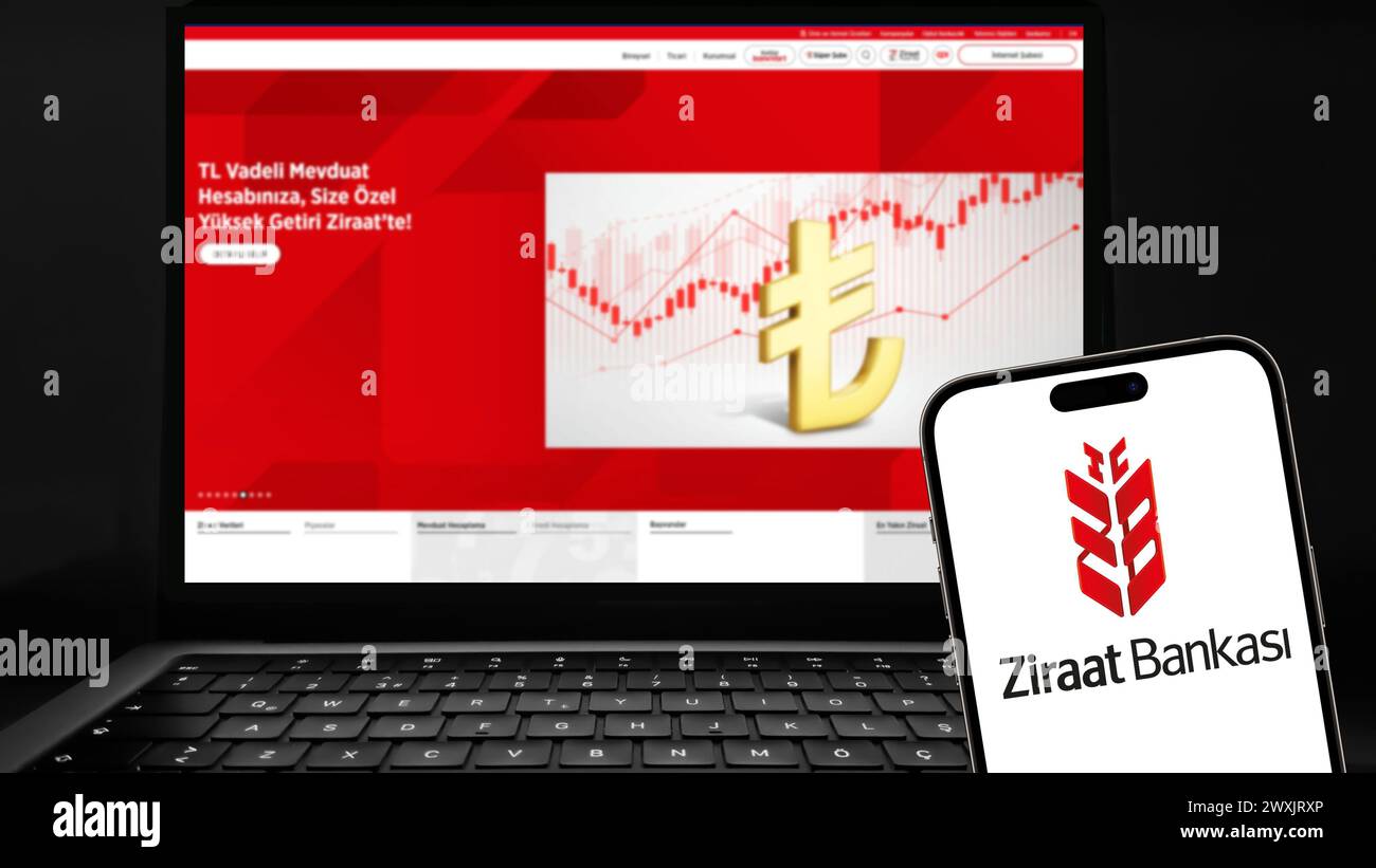 Istanbul, Turkey - 27 March 2024: Ziraat Bank logo on smartphone screen with its website in background. Ziraat Bank is a Turkish state-owned bank and Stock Photo