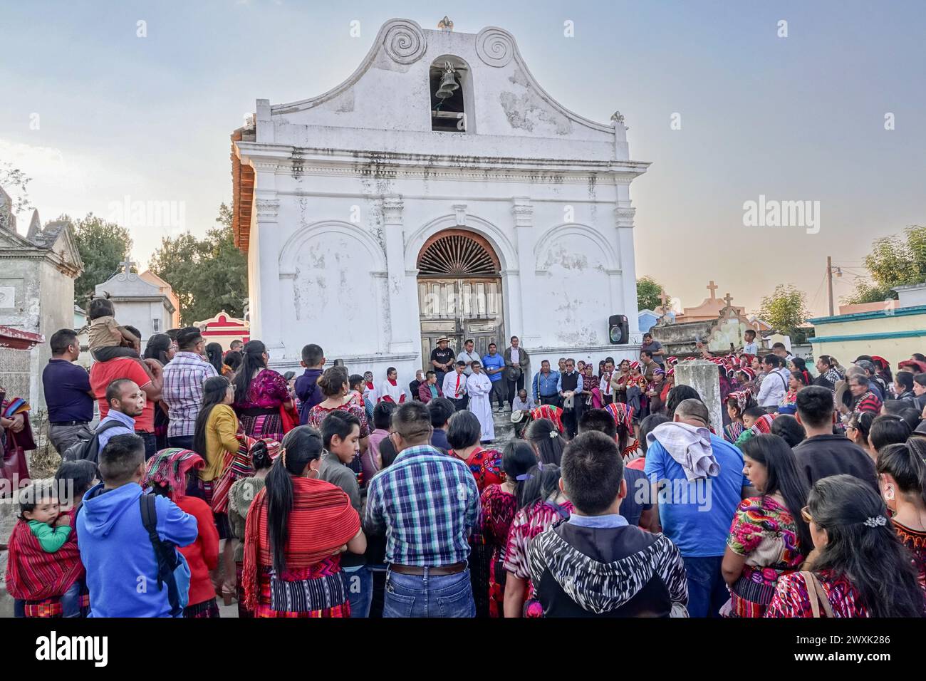 Chichicastenango, Guatemala. 30th Mar, 2024. A Catholic priest leads a Christian and Mayan ceremony at the start of a candlelit vigil for Jesus on Holy Saturday at the Cementerio De Chichicastenango, March 30, 2024 in Chichicastenango, Guatemala. The Catholic Church and Mayan beliefs long ago mixed together in indigenous regions of Guatemala in a process called syncretism. Credit: Richard Ellis/Richard Ellis/Alamy Live News Stock Photo