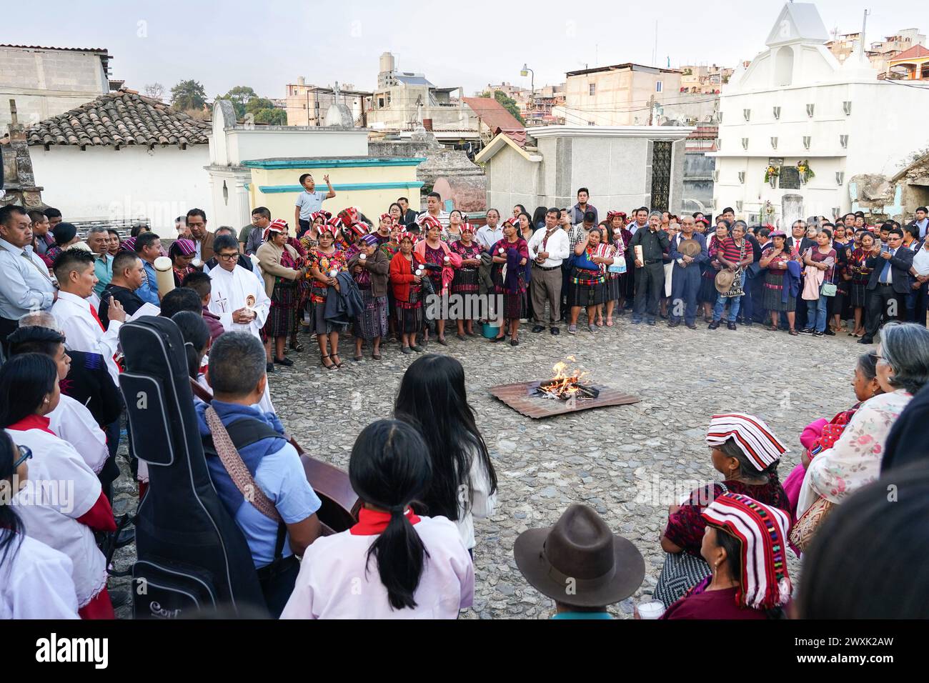 Chichicastenango, Guatemala. 30th Mar, 2024. A Catholic priest leads a Christian and Mayan ceremony at the start of a candlelit vigil for Jesus on Holy Saturday at the Cementerio De Chichicastenango, March 30, 2024 in Chichicastenango, Guatemala. The Catholic Church and Mayan beliefs long ago mixed together in indigenous regions of Guatemala in a process called syncretism. Credit: Richard Ellis/Richard Ellis/Alamy Live News Stock Photo