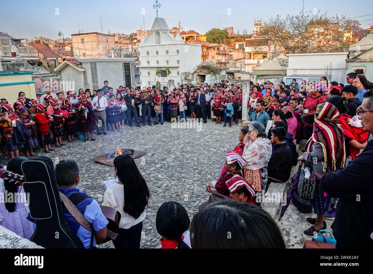 Chichicastenango, Guatemala. 30th Mar, 2024. A Catholic priest leads a Christian and Mayan ceremony at the start of a candlelit vigil for Jesus on Holy Saturday at the Cementerio De Chichicastenango, March 30, 2024 in Chichicastenango, Guatemala. The Catholic Church and Mayan beliefs long ago mixed together in indigenous regions of Guatemala in a process called syncretism. Credit: Richard Ellis/Richard Ellis/Alamy Live News Stock Photo