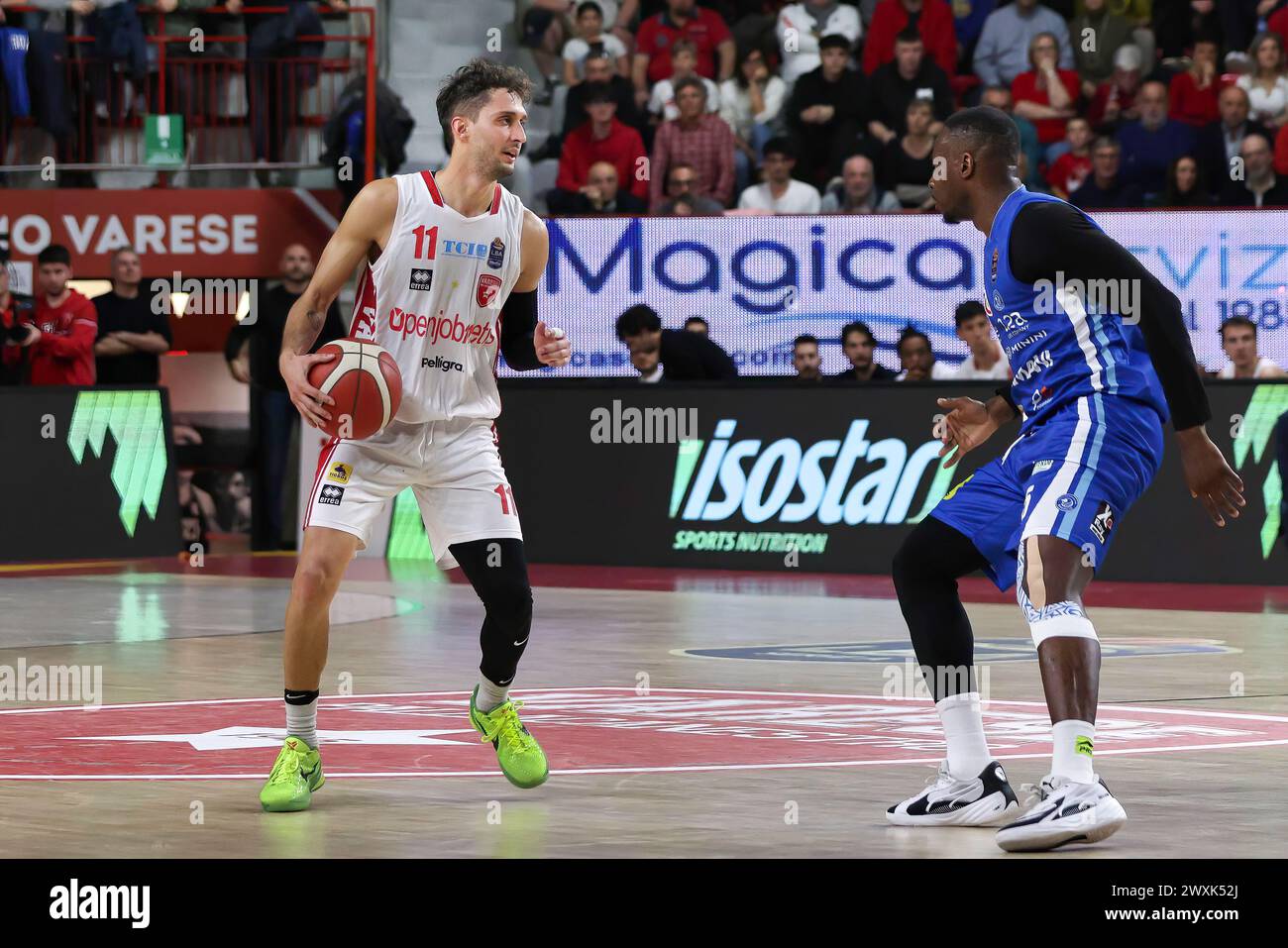 Varese, Italy. 30th Mar, 2024. Italy, Varese, march 30 2024: Davide Moretti (Varese) dribbles in front court in the 4th quarter during basketball game OpenJobMetis Varese vs Germani Brescia, LBA 2023-2024 day 25OpenJobMetis Varese vs Germani Brescia - Lega Basket Serie A day 25 at Itelyum Arena on march 30 2024 (Photo by Fabrizio Andrea Bertani/Pacific Press) Credit: Pacific Press Media Production Corp./Alamy Live News Stock Photo