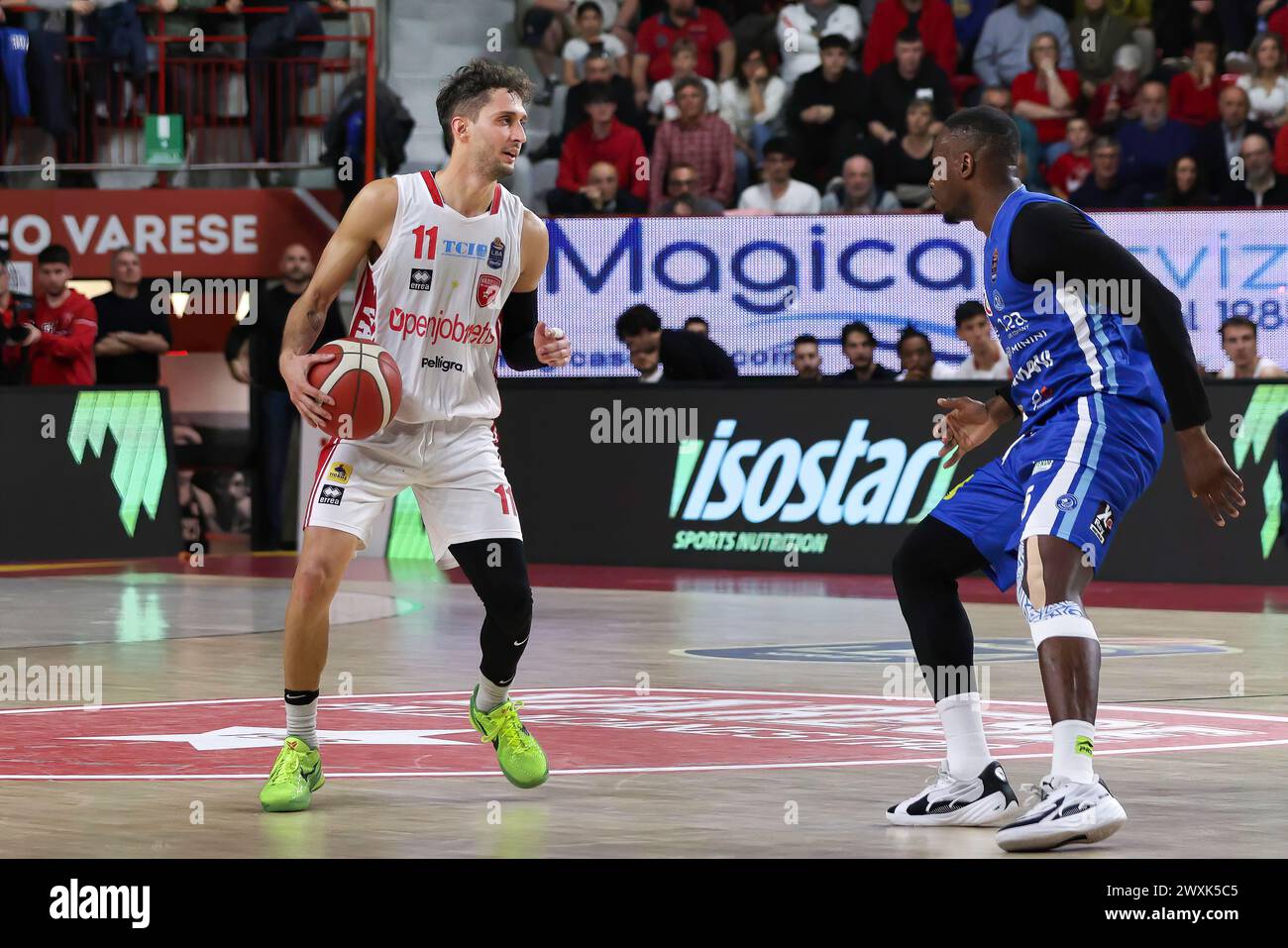 Varese, Italy. 30th Mar, 2024. Italy, Varese, march 30 2024: Davide Moretti (Varese) dribbles in front court in the 4th quarter during basketball game OpenJobMetis Varese vs Germani Brescia, LBA 2023-2024 day 25.OpenJobMetis Varese vs Germani Brescia - Lega Basket Serie A day 25 at Itelyum Arena on march 30 2024 (Credit Image: © Fabrizio Andrea Bertani/Pacific Press via ZUMA Press Wire) EDITORIAL USAGE ONLY! Not for Commercial USAGE! Stock Photo