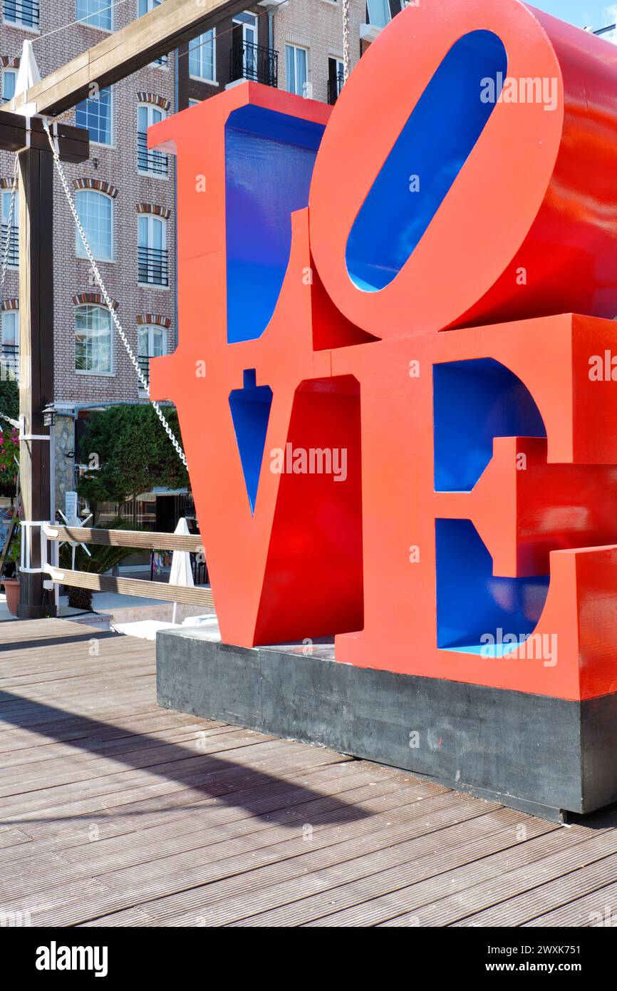 'LOVE' written with capital red letters outdoor as photo background and decoration Stock Photo