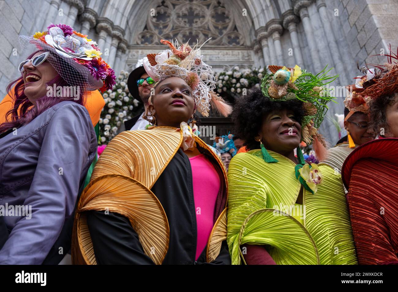 New York City, United States. 31st Mar, 2024. A group of black women are dressed up for Easter on the steps of St. Patrick's Cathedral. New York's Easter Parade and Bonnet Festival dates back to the 1870s. An Anual event, New Yorkers don colorful and creative Easter outfits to show off in front of St Patrick's Cathedral on Fifth Avenue. (Photo by Syndi PIilar/SOPA Images/Sipa USA) Credit: Sipa USA/Alamy Live News Stock Photo